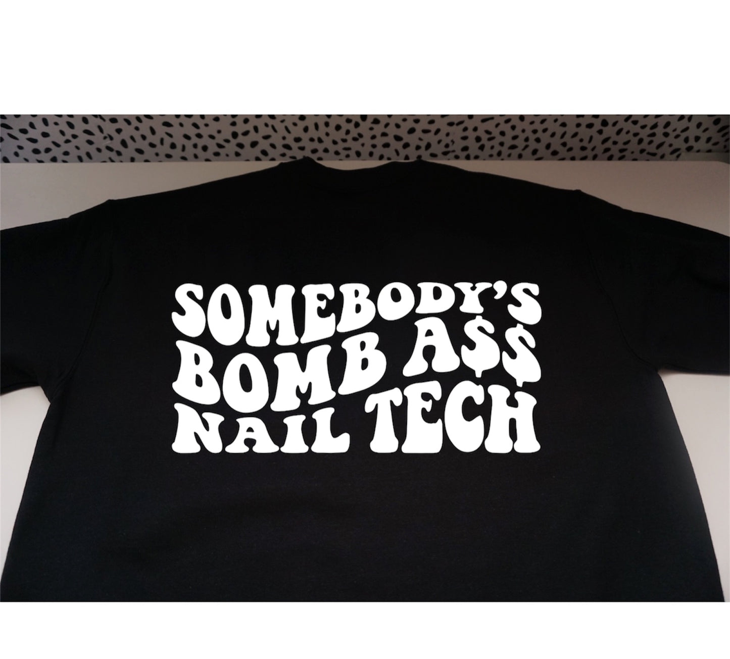 SOMEBODY’S BOMB ASS NAIL TECH sweatshirt.